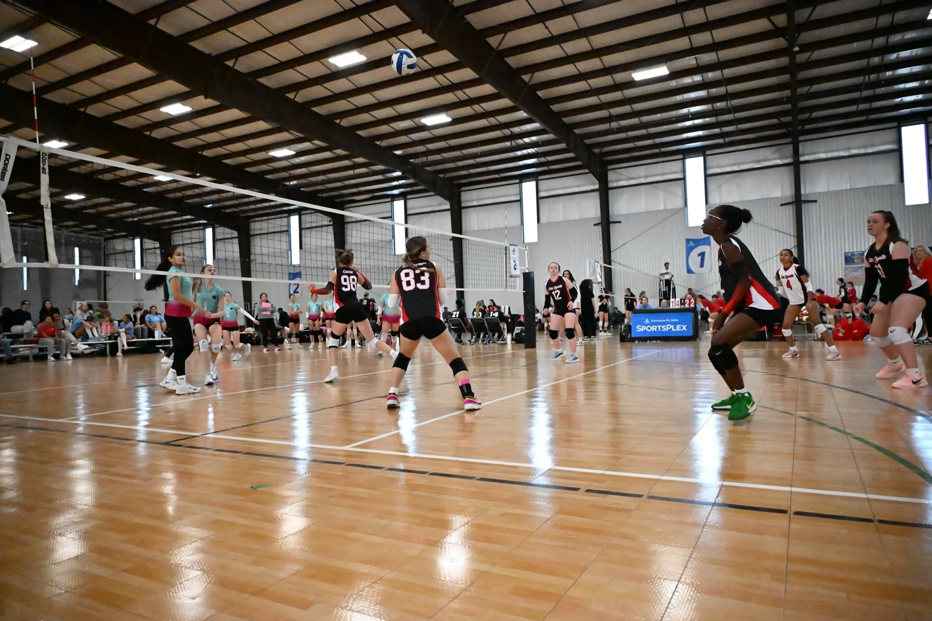 OKC Ignite players warming up on the court at SportsPlex tournament