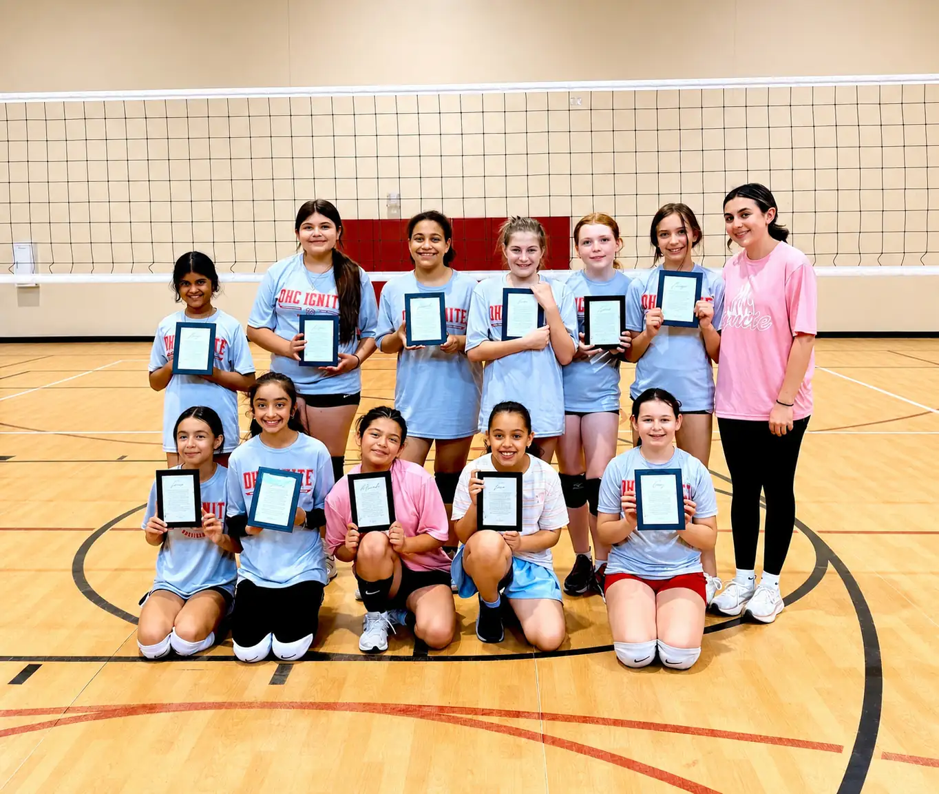 OKC Ignite young players in pink uniforms